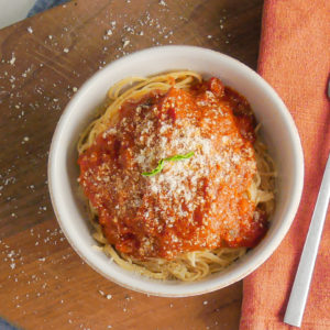 Tomato sauce over angel hair pasta with parmesan cheese