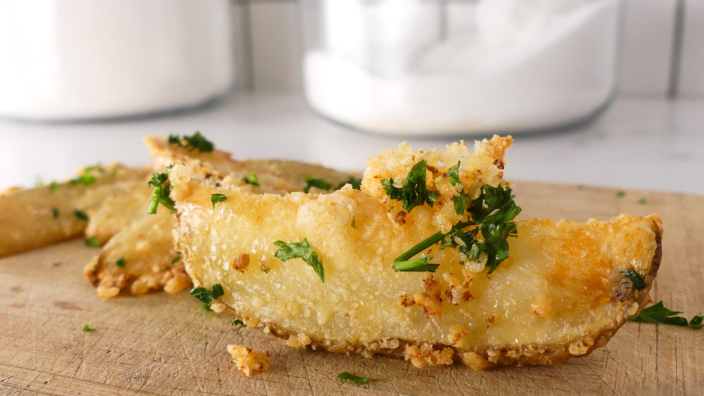 Potato wedge with parmesan cheese and parsley