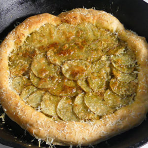 Pesto Potato Pizza in a cast iron skillet