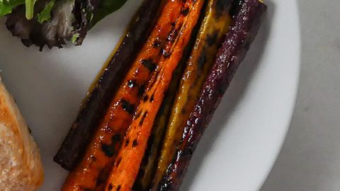 grilled carrots on a white plate