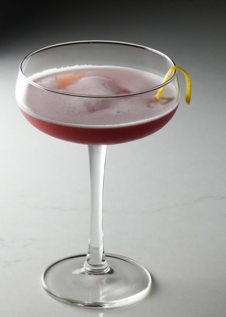 French martini with a twist of lemon and cassis