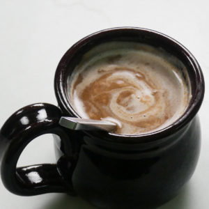 pumpkin spice hot chocolate in a brown mug
