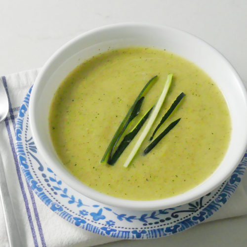 zucchini soup in a white bowl